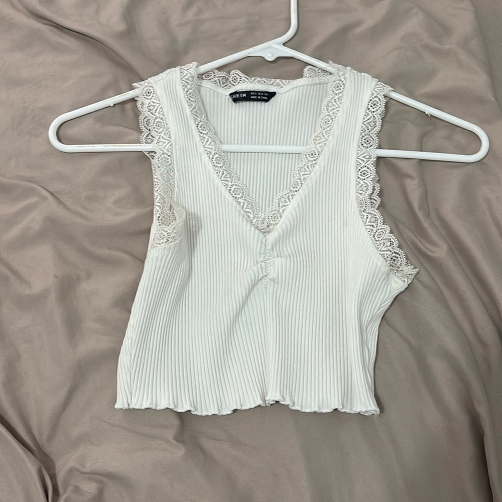 White tank top it’s also cropped size small with lace outlines